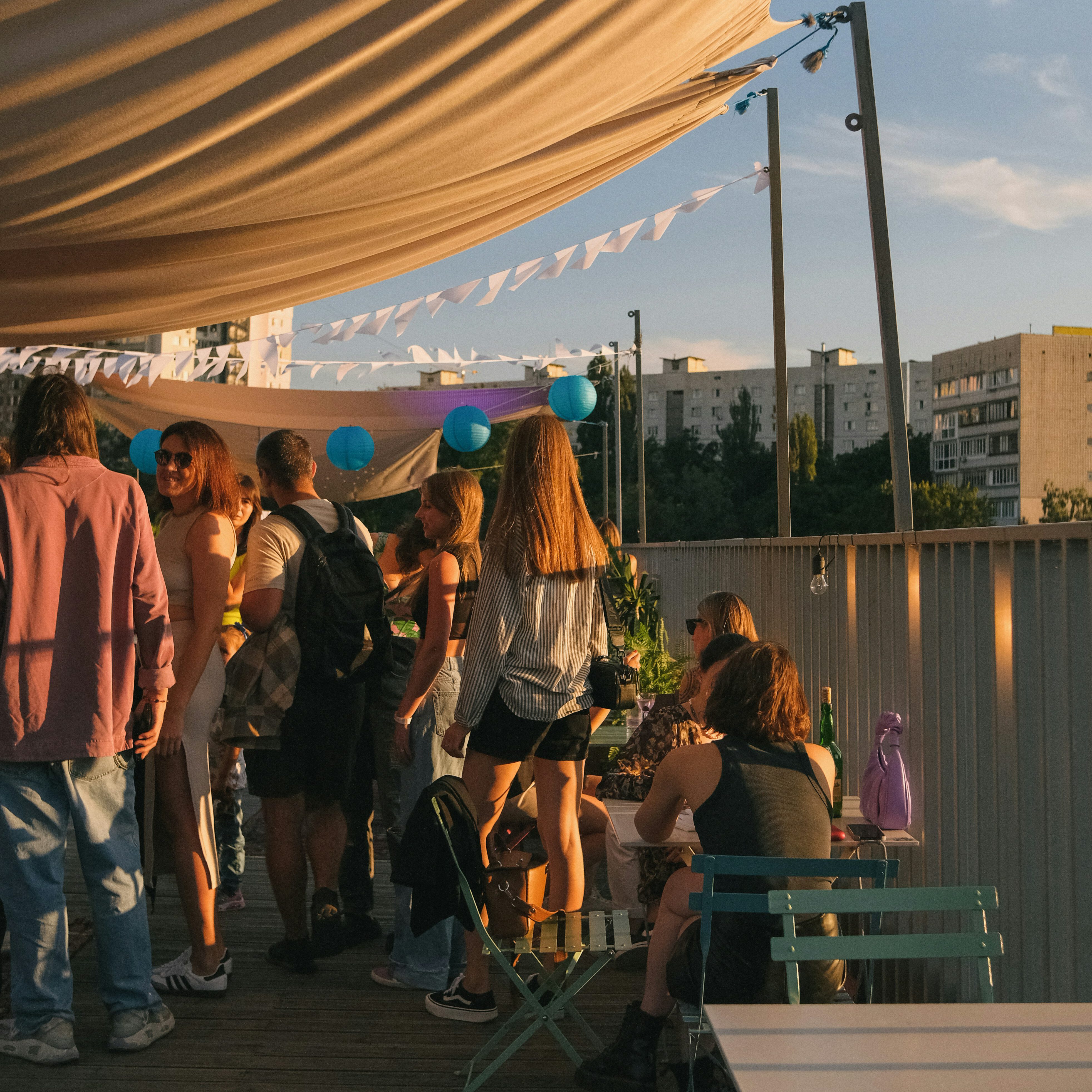 Group enjoying outdoor hotel space arranged through Event Express group accommodation services.