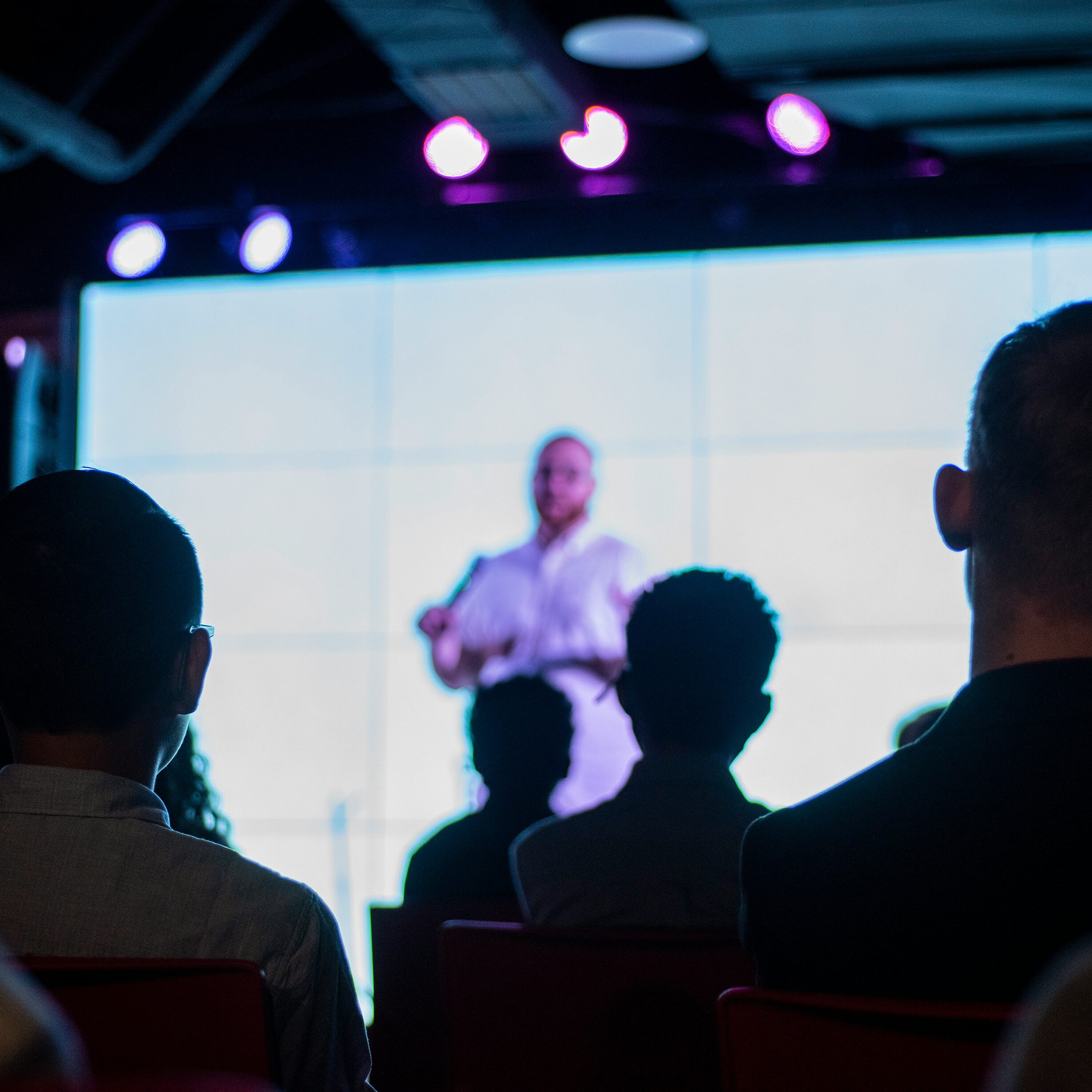 Event speaker presenting at a conference with accommodation supported by Event Express.